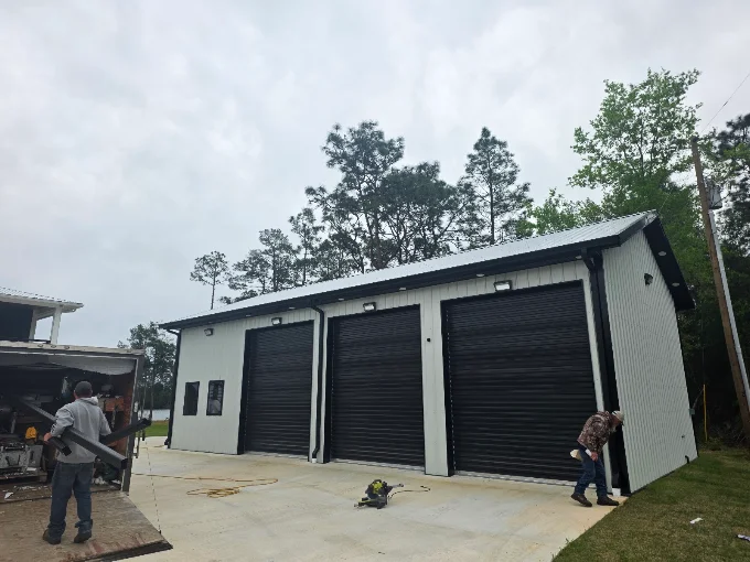 Seamless gutter installation on a detached three-bay garage or workshop.