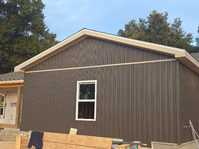 Fascia and soffit work completed along the roofline of a workshop building.